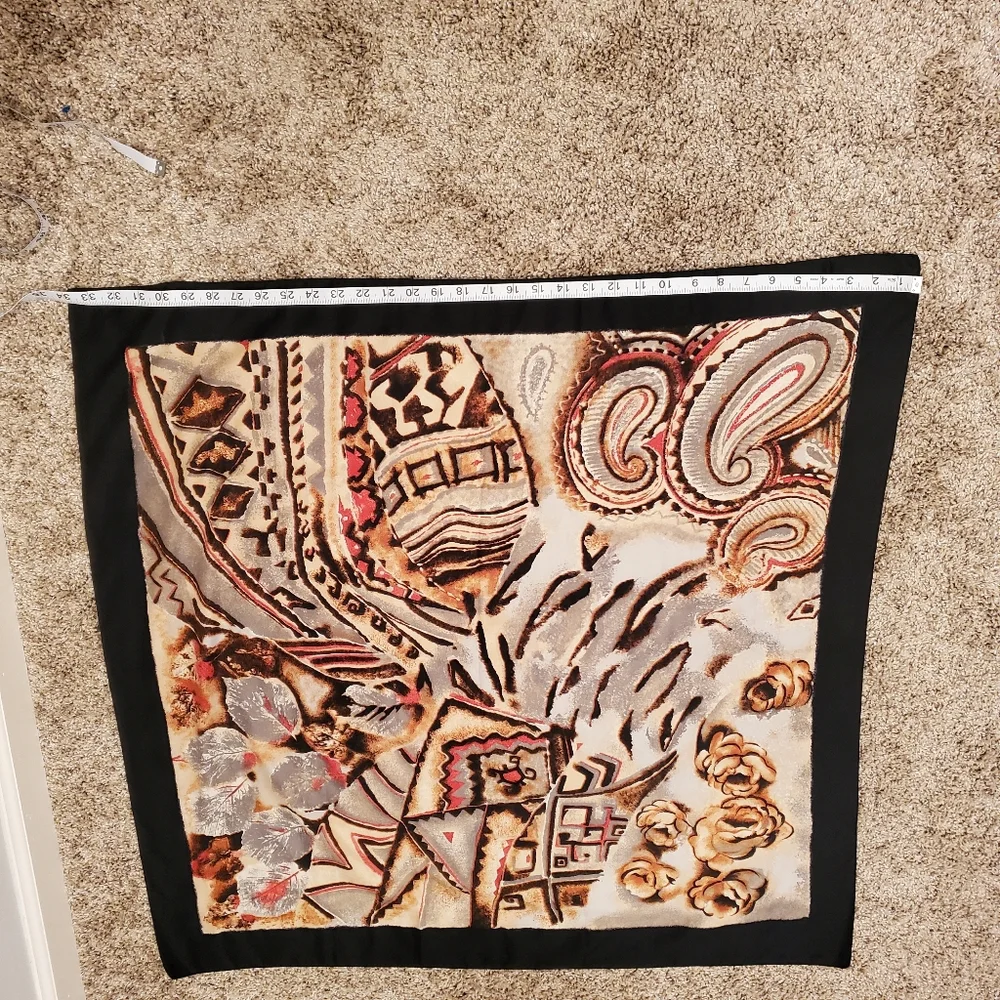 scarf with a black outline and a multi-colored abstract floral and paisley
